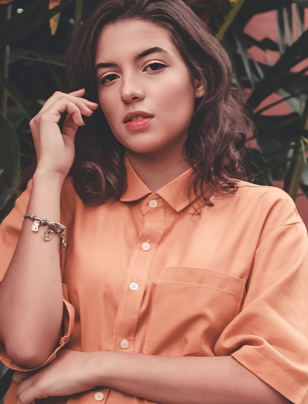 model with orange shirt